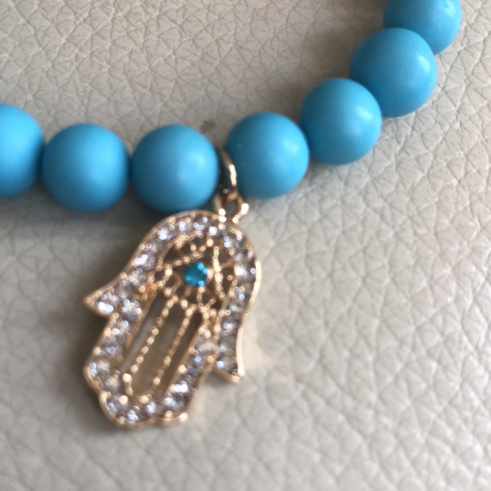 Madison Tyler cute beaded blue bracelet with gold tone charm. New with tags.